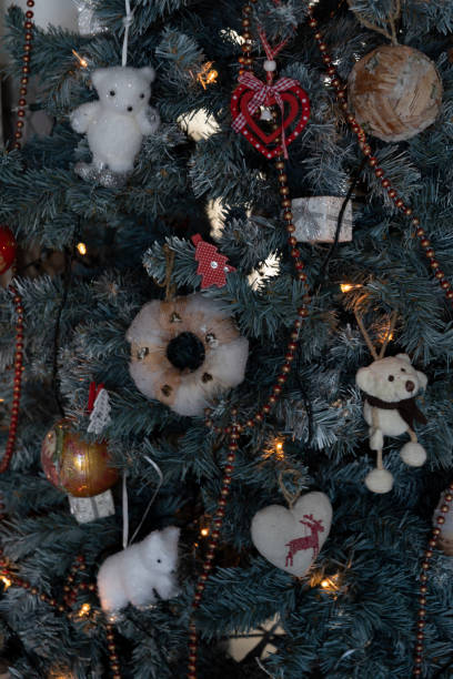 istock bears and balls as ornaments in a Christmas tree 1296562406