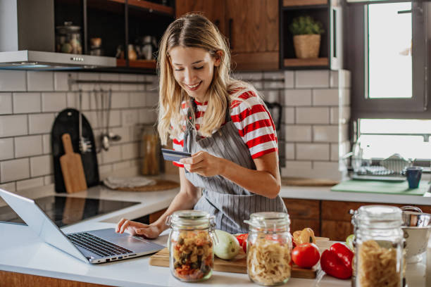 istock Young woman ordering food ingredients online 1296565021