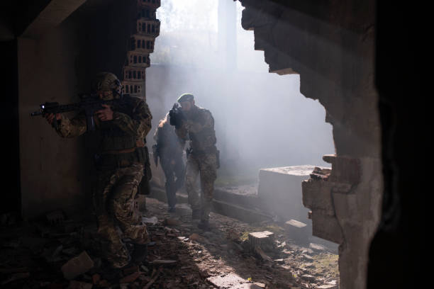 istock Group of soldiers in attacking position. 1296565549