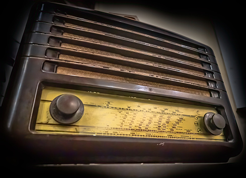 Retro old radio with dirty and dust of time, isolated on a white background, front view, retro things concept