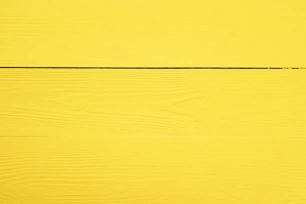 istock Bright yellow wooden background for your design 1296568042