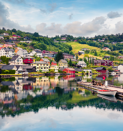 Rainy summer view of Norheimsund village, located on the northern side of the Hardangerfjord. Colorful morning scene in Norway, Europe. Traveling concept background.