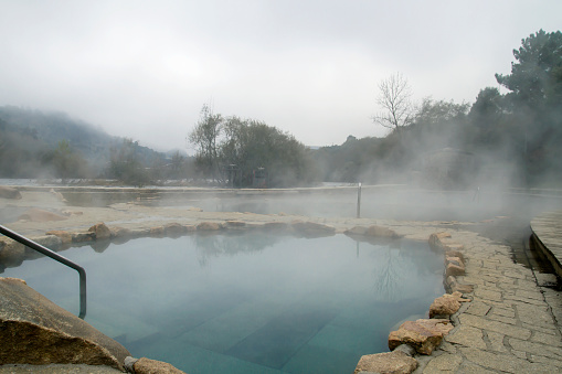 Hot springs MuinÌo da Veiga, pools in MiÃ±o riverbed in Ourense, Spain