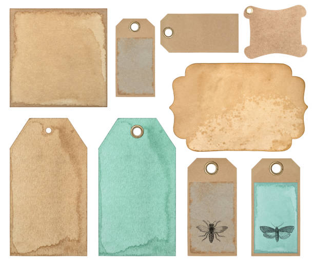 istock Used paper tags Old cardboard card stains isolated 1296568867