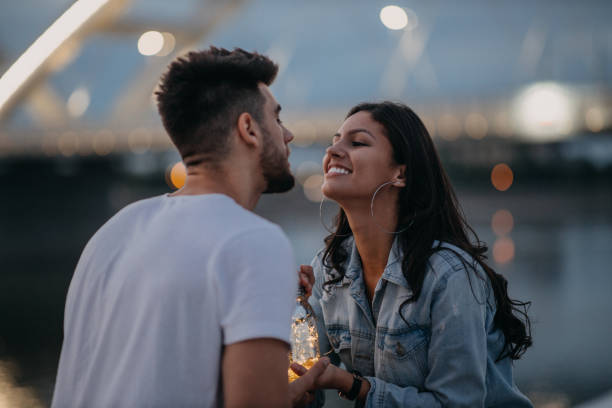 istock An affectionate young couple bonding together outdoors 1296568966