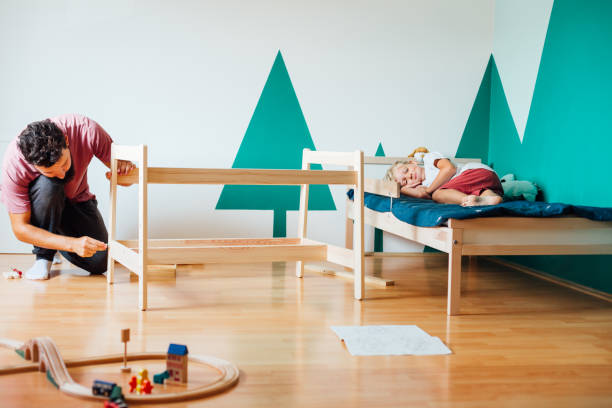 istock Father And Son Working On Carpentry At Home 1296573599