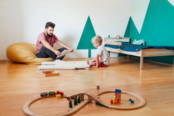 istock Father And Son Working On Carpentry At Home 1296573747