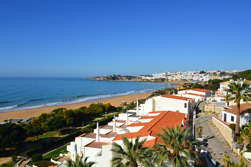 Albufeira, Algarve / Faro district, Portugal: Praia dos Alemães with the town and Praia dos Pescadores in the background (Germans' beach and Fishermen beach).