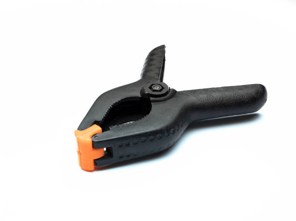 istock Black muslin clamp with orange pads for use in photo studio 1296575619