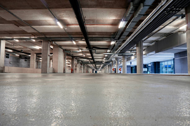 istock Parking garage underground with vacant places for cards. 1296575736