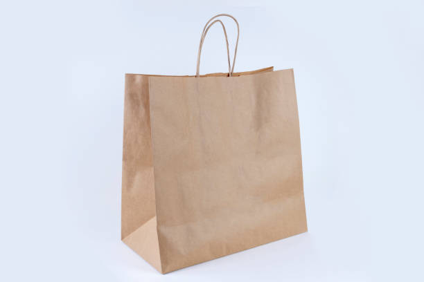 istock Recycled paper shopping bag on white background 1296576950