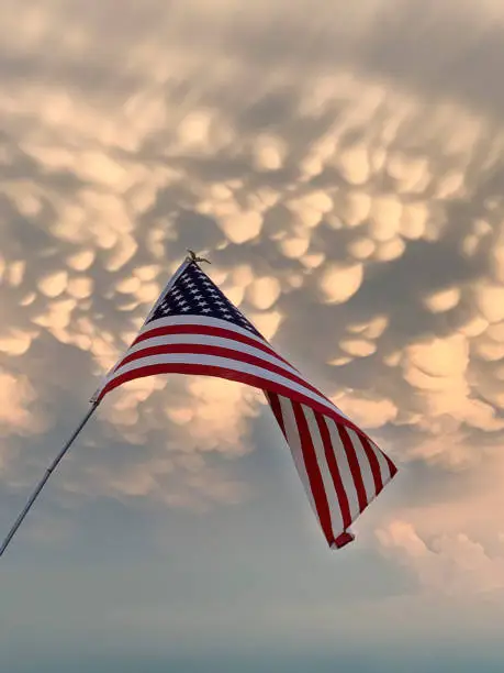 Photo of American Flag with mammatus storm clouds