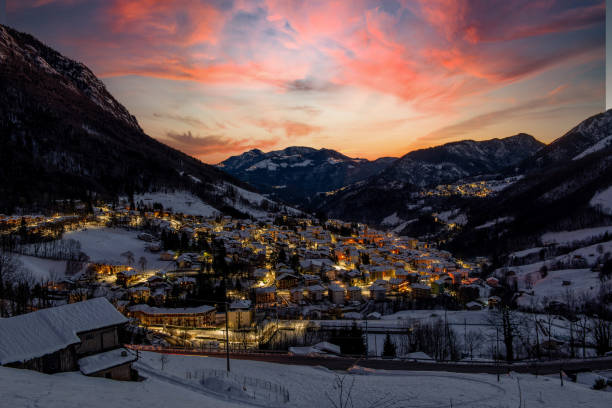 istock Mountain village icon snow at sunset 1296588991