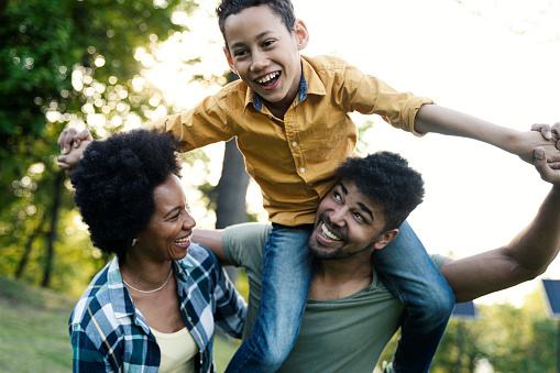 Young loving family having fun in the park