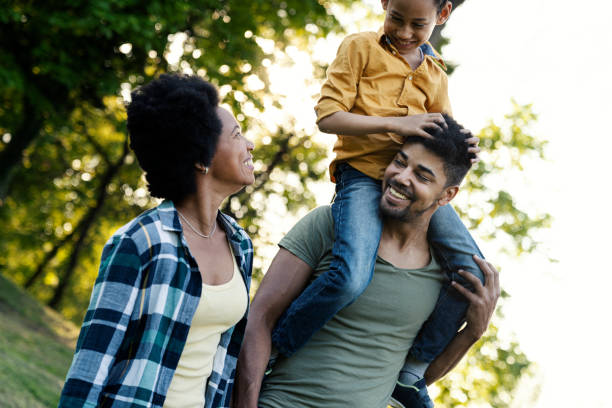 istock Young loving family having fun in the park 1296593821