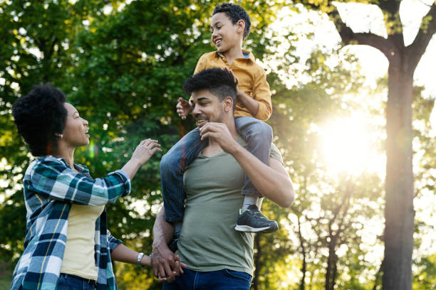 istock Young loving family having fun in the park 1296593823