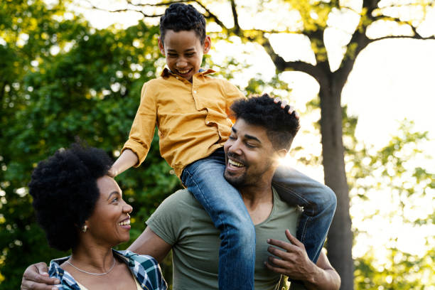 istock Young loving family having fun in the park 1296593825