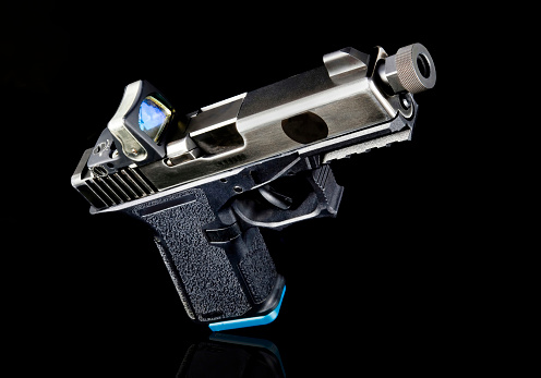 9mm semi-auto pistol with tritium sight.