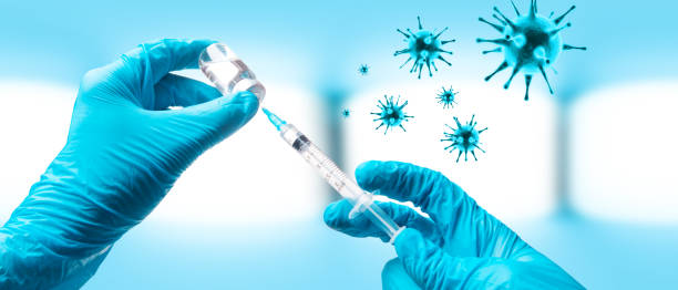 istock Hand holding viol with vaccine against corona virus. 1296595545