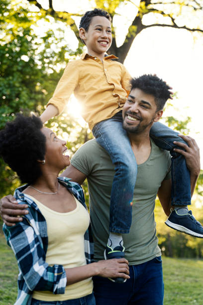 istock Young loving family having fun in the park 1296595936