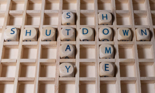 istock Wooden Letters Shutdown Stay Home 1296596675