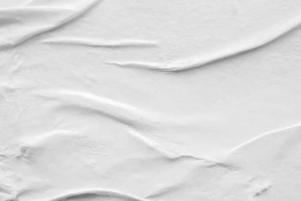 istock Blank white crumpled and creased paper poster texture background 1296597184