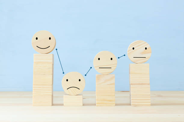 istock Concept image of satisfaction level. wooden circles with emotions 1296608854