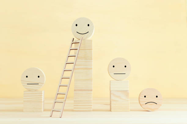 istock Concept image of satisfaction level. wooden circles with emotions 1296608857