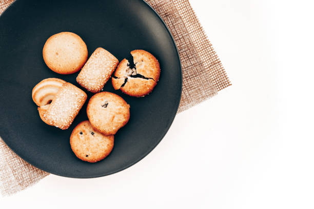 istock Butter cookies in a black plate on a white background. 1296617278