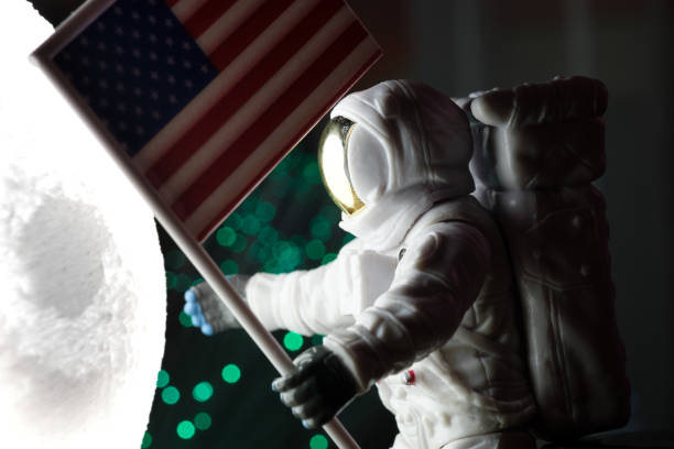 istock Toy astronaut with american flag 1296621203