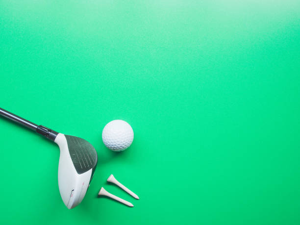 istock Golf equipment flat lay on green background. Top view 1296624519