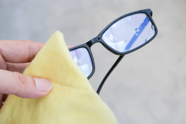 istock The white man's hands cleaned his glasses with a clean cloth. 1296626845
