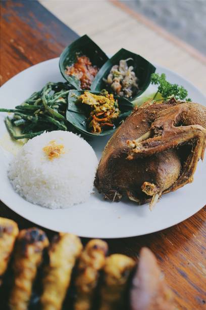 istock Duck fried Balinese style with Sate for lunch and dinner 1296628518
