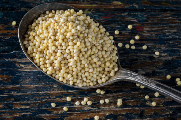 istock Uncooked Millet on a Vintage Spoon 1296630474
