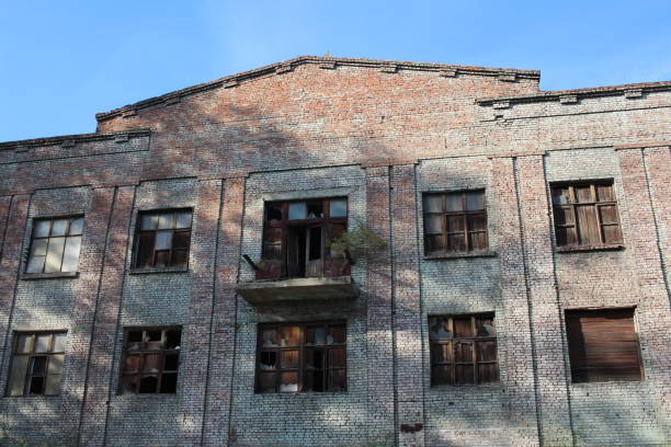 istock the old brick building destroyed by broken Windows of a deserted 1296632216