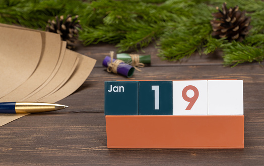 January 19, date on the calendar. cube with date month and day. planning for the day. selective focus.