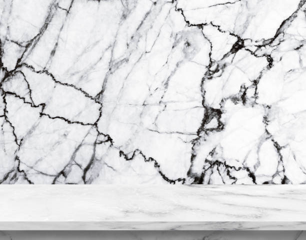 istock White empty marble table on white marble background, used for product display with copy space for display or montage your products. 1296638132