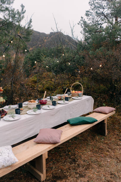 istock Served wedding table among trees in autumn in Altai 1296642181