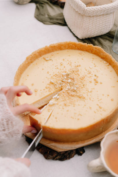 istock Hands cut a wedding cake in autumn in Altai 1296642190