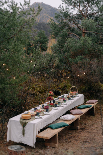 istock Served wedding table among trees in autumn in Altai 1296642203