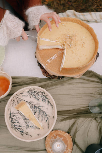 istock Hands cut a wedding cake in autumn in Altai 1296642207