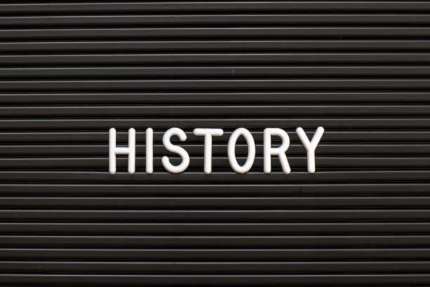 White alphabet in word history on black color felt letter board background