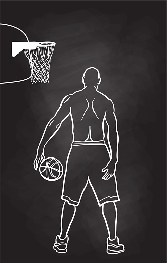 Athlete with muscular build playing basketball