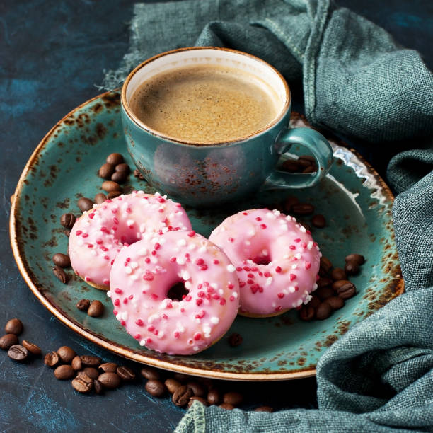istock Tasty sweet donuts  and coffee mug 1296647843