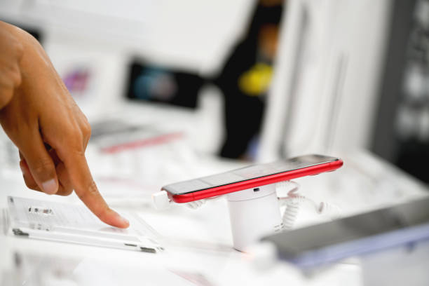 istock Choosing smart phone in the store 1296648561