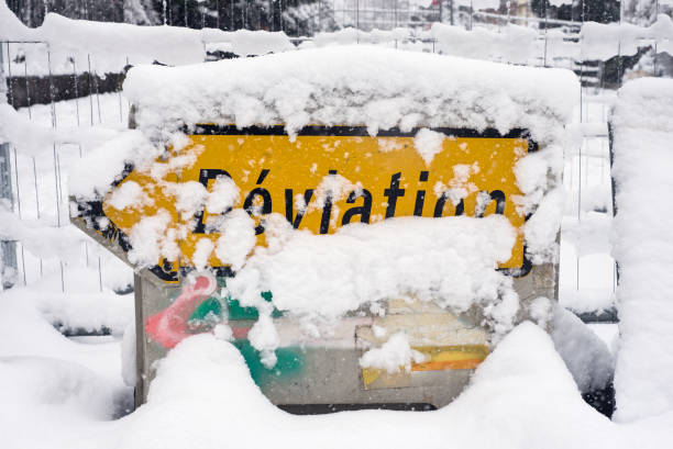 istock deviation panel covered by the snow in the street 1296651501