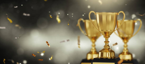 istock Golden trophy cup on dark background. copy space for text. 3d rendering. 1296652454