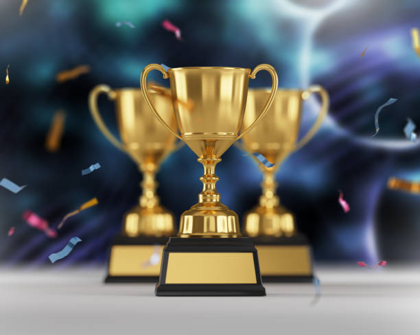 istock Golden trophy cup on dark background. copy space for text. 3d rendering. 1296652456