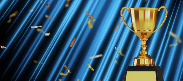 istock Golden trophy cup on blue background. copy space for text. 3d rendering. 1296652463