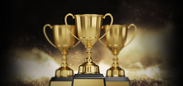 istock Golden trophy cup on dark background. copy space for text. 3d rendering. 1296652476